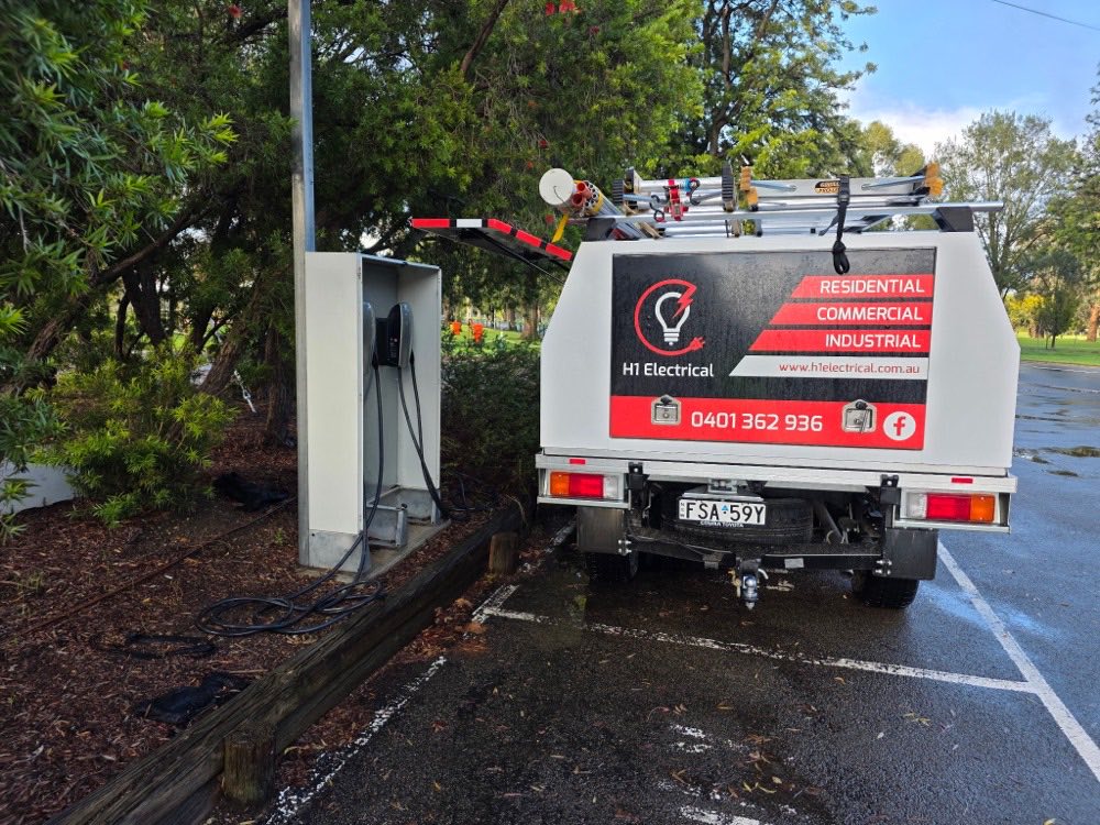 H1 Electrical & Air van on site at a public EV charging station in the Cowra region