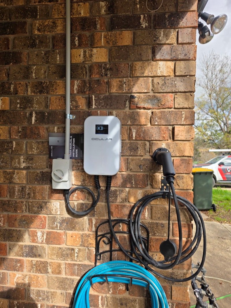 A wall-mounted EV charger installed by H1 Electrical & Air on a Cowra home
