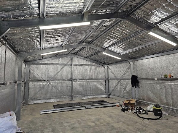 Bright LED batten lighting running the length of a rural shed near Cowra by H1 Electrical & Air
