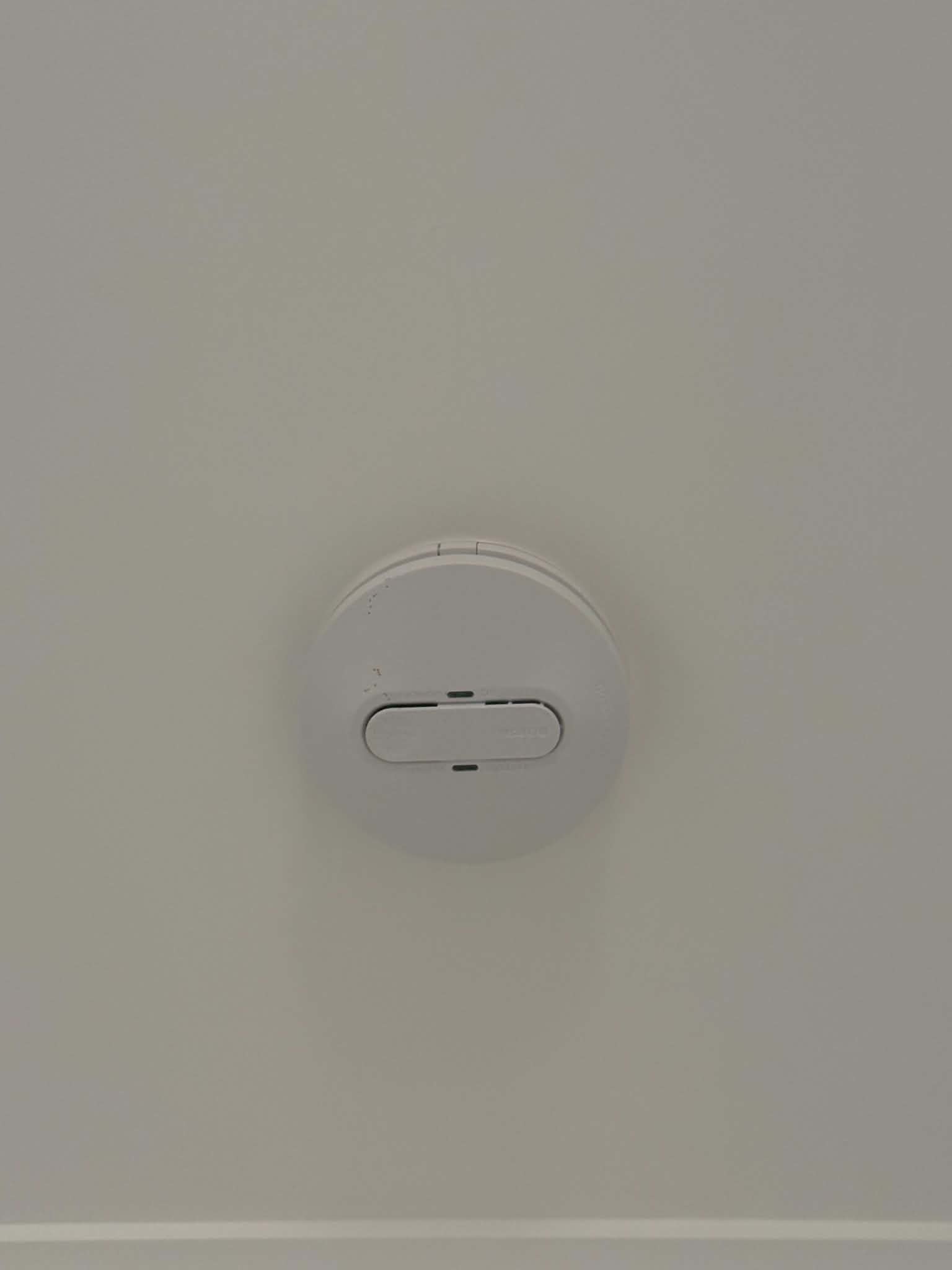 Hard-wired photoelectric smoke alarm mounted on a ceiling by H1 Electrical & Air in a Cowra home
