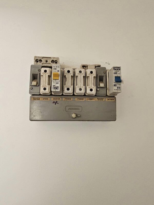 Old ceramic-fuse switchboard before upgrade in a Cowra home